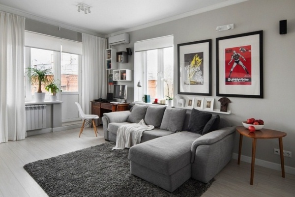 interior-design-ideas-living-room-gray-dark-wall-paneling-black-coffee-table-carpet-pattern