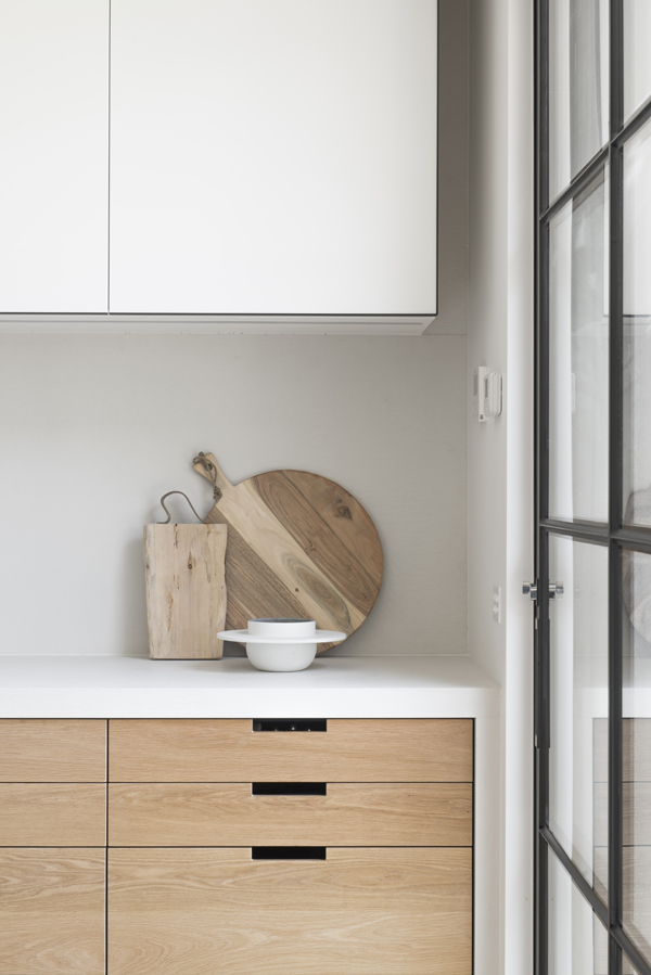 modern kitchen, wood and white, black steel-framed door