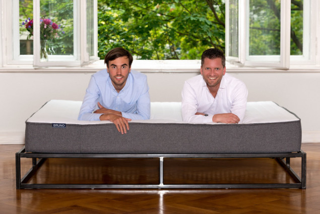Felix Baer and Andreas Bauer, The Founders of Bruno Mattress lying on one of their mattresses