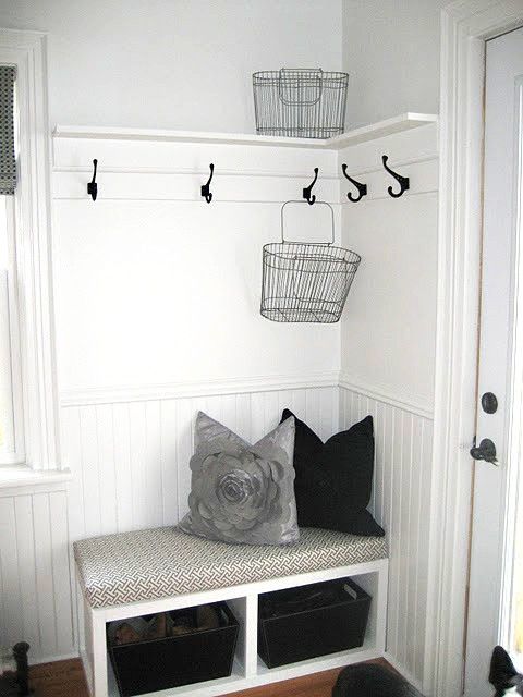 white mudroom with black accents