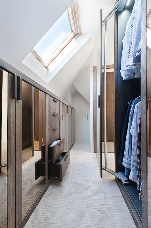 attic closet with drawers and a wardrobe