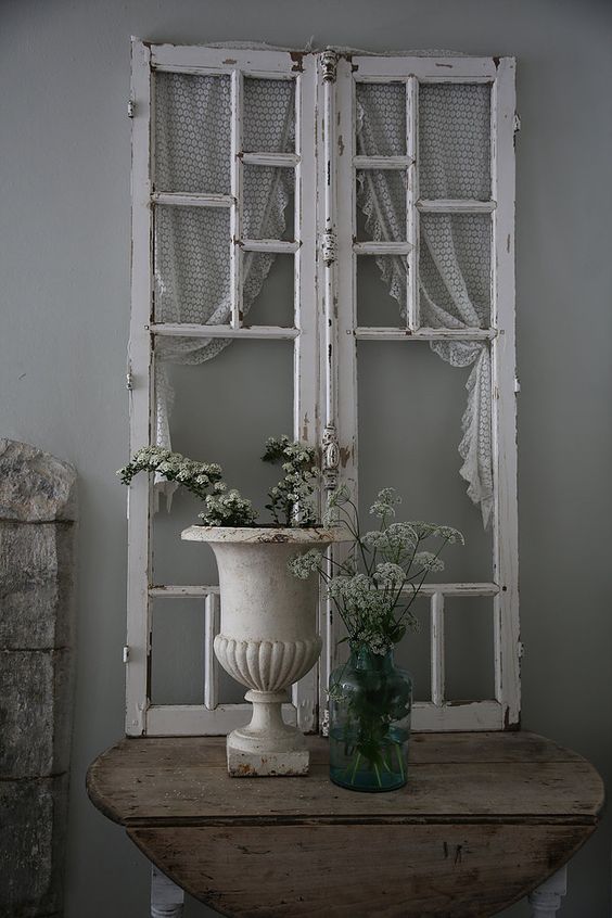 an old window can be a cool decoration for a shabby chic entryway