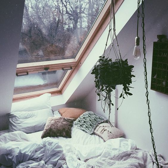 cozy sleeping nook with a window overhead