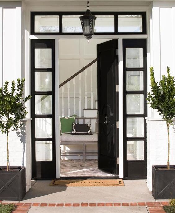 black glossy front door with sidelights