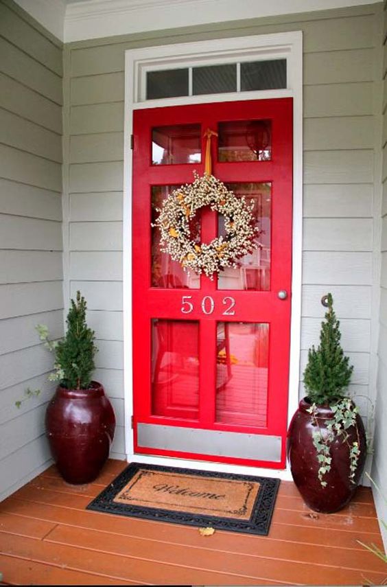 red glass door with burgundy containers