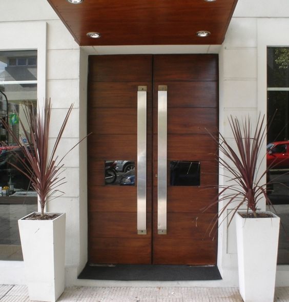 front wooden doors with glass panes and large handles