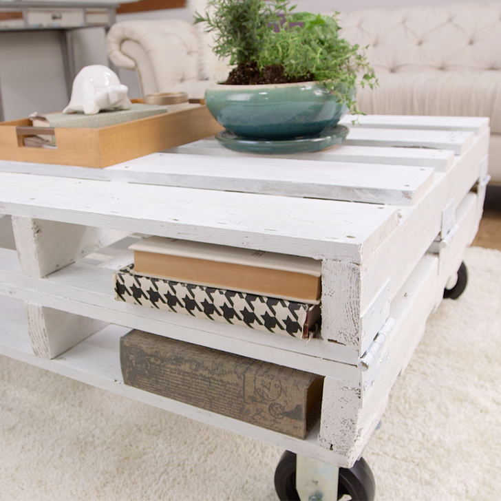 DIY whitewashed pallet coffee table with two storage shelves