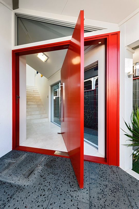 oversized bold red pivot front door