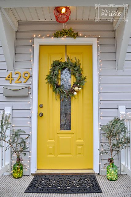 sunny yellow front door with a narrow pane