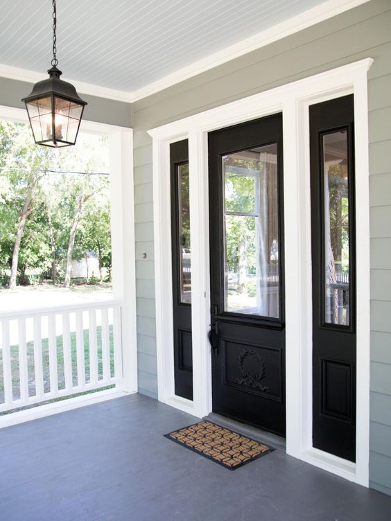 black door and sidelights mixed with white framing