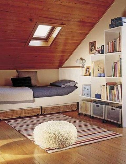 attic sleeping nook with a window
