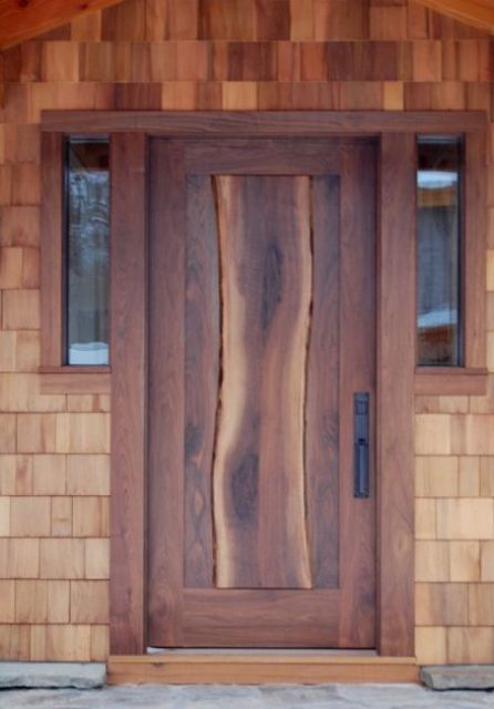 entry door with thick walnut slab flowing down the center