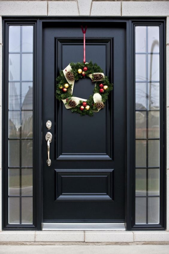 elegant black front door with framed sidelights