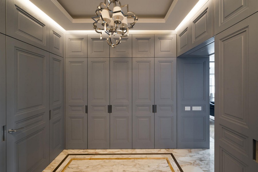1-American-style-interior-wooden-panelling-closets-blue-invisible-doors-hallway-entrance-hall-entry-room-white-marble-floor-tiles