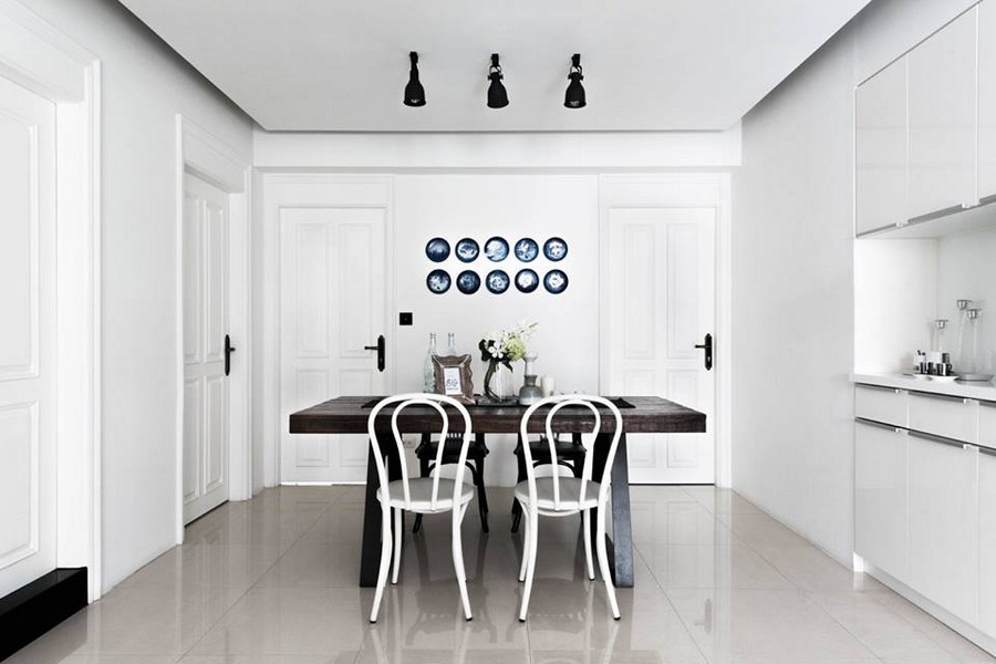 2-0-eclectic-Scandinavian-and-French-style-interior-white-walls-dining-room-set-dark-brown-table-mismatched-chairs-blue-decoartive-wall-plates-Copenhagen-minimalist-kitchen-set
