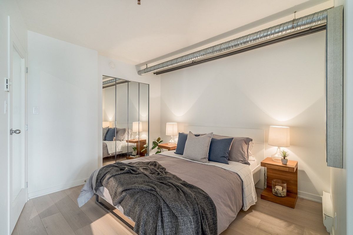 Mirrored wardrobes expanding the feel of a small bedroom