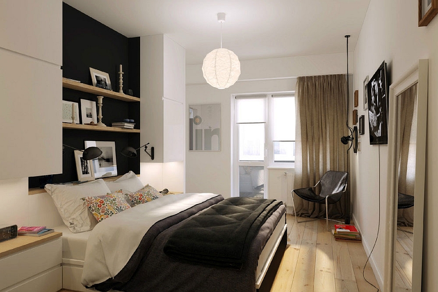 Clever shelving above a bed maximizing vertical space in a small apartment bedroom