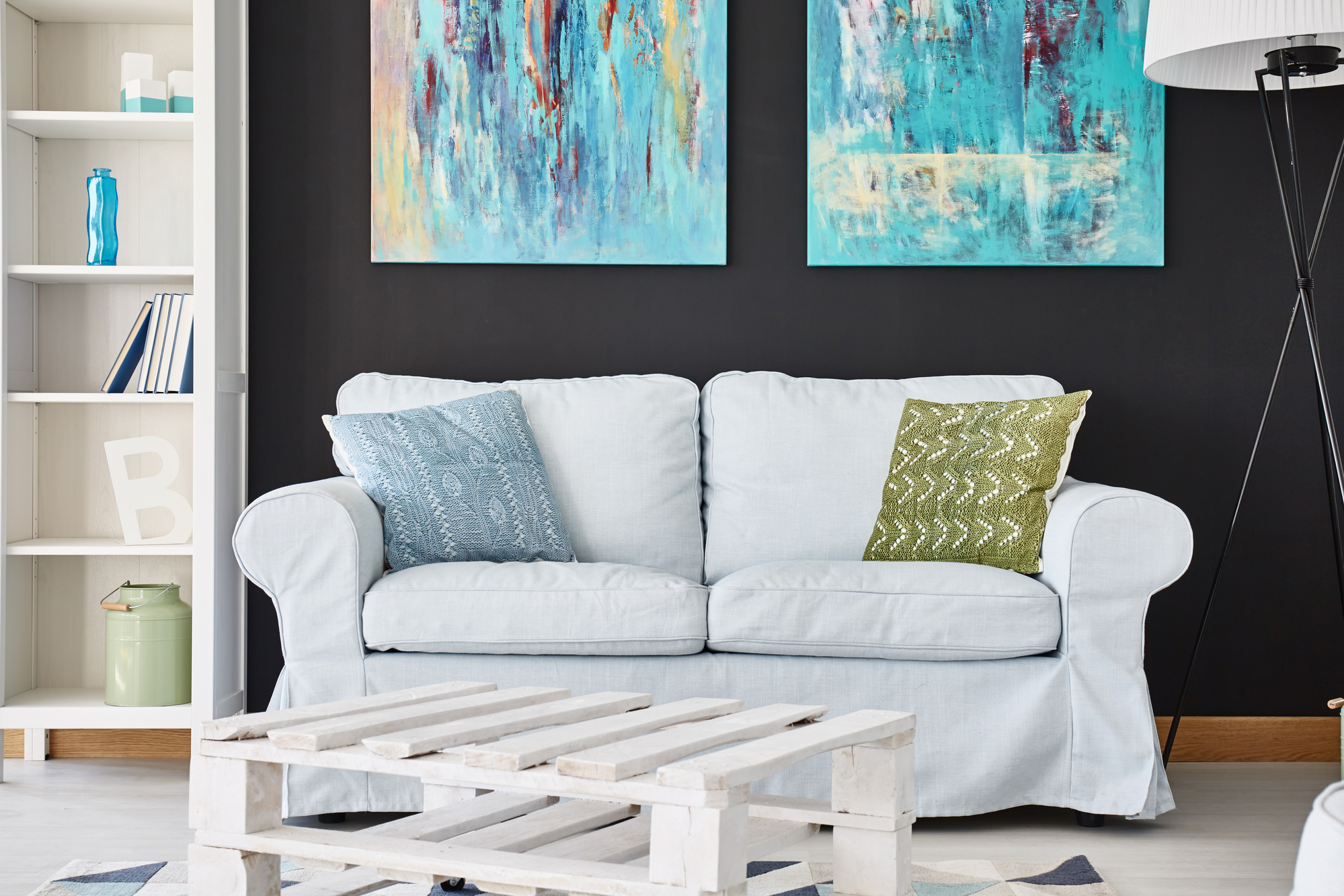 Cozy living room with warm wall art, textiles, and earthy tones