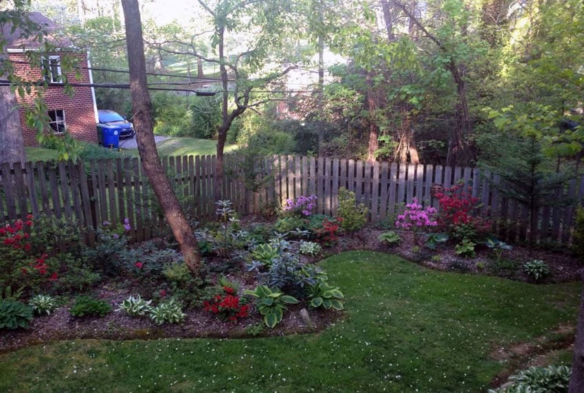Garden landscape with short wood fence