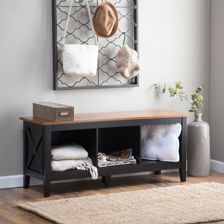 Small entryway decorated in gray tones with a storage bench and ceramic vase in the corner