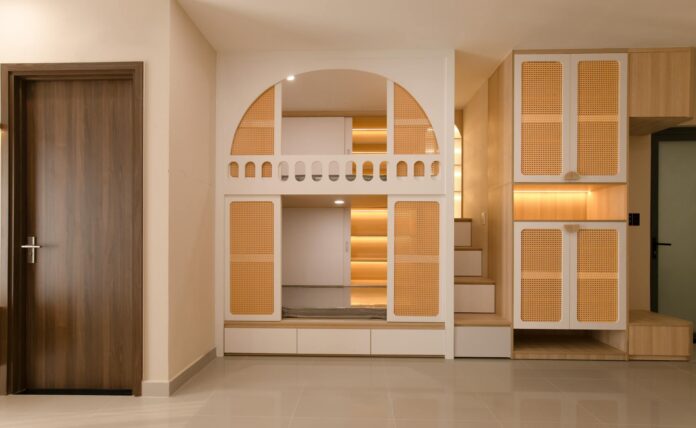 pexels-15867404-1 Stylish minimalist interior with integrated storage solutions and warm lighting.