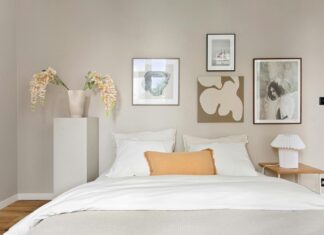 8 Bedroom Color Palette Ideas That Set the Perfect Mood for Restful Sleep Elegant minimalist bedroom with modern artwork and decor, exuding calmness.