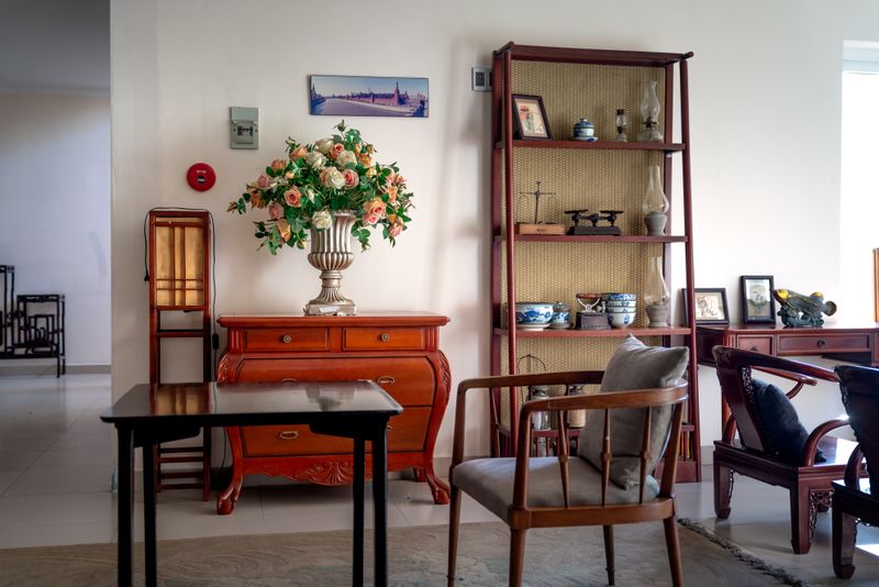 Classic living room interior featuring a floral bouquet and stylish decor