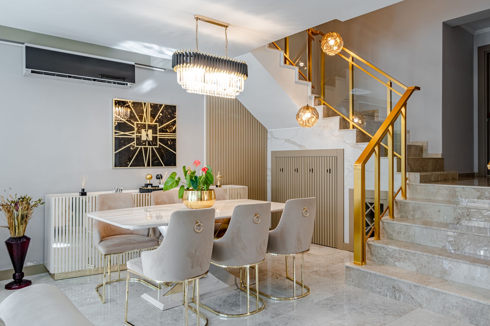 Modern dining room with marble table and gold accents