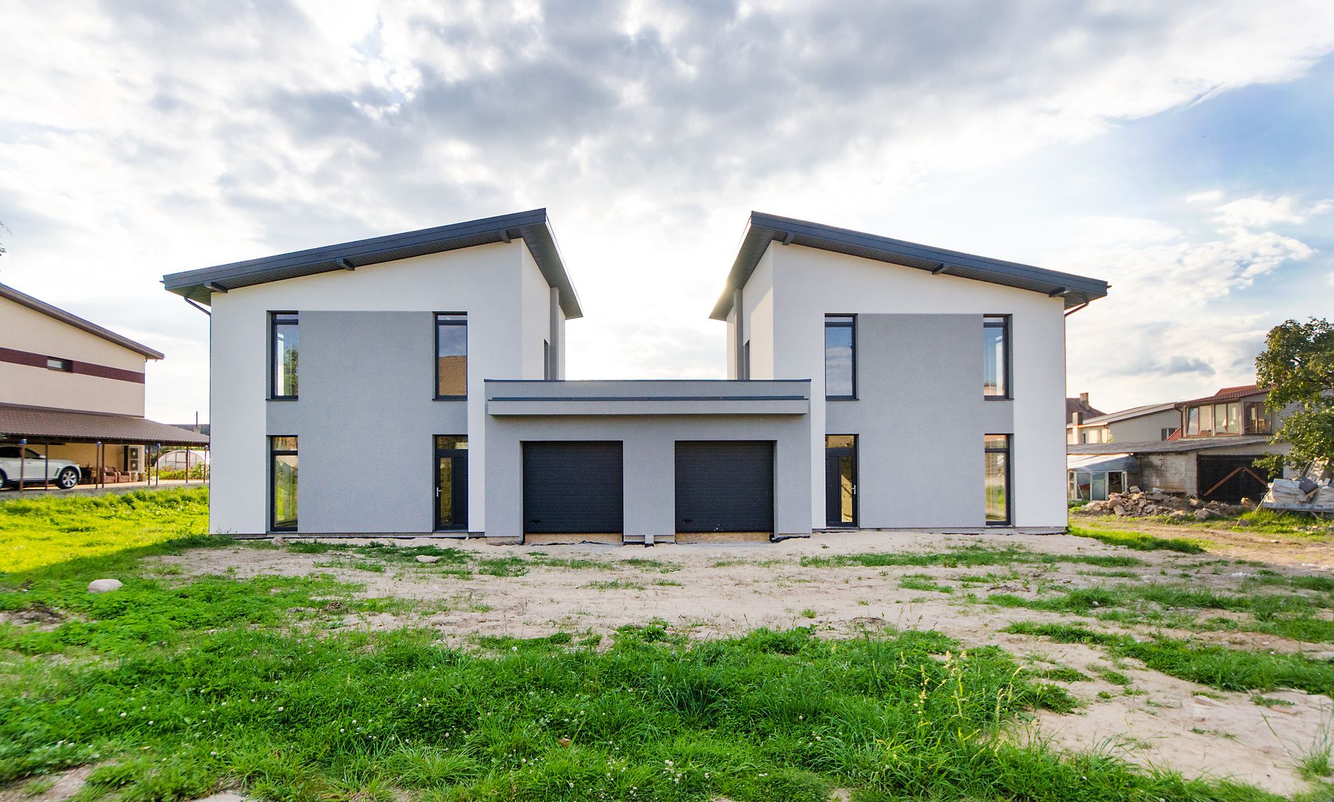 Front view of twin modern houses with contemporary design