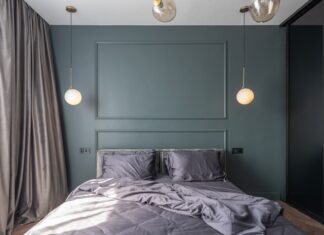9 Bedroom Organization Ideas to Maximize Space and Create a Calmer Sleep Sanctuary Interior design of modern bedroom with unmade bed under luminous lamps at sunlight