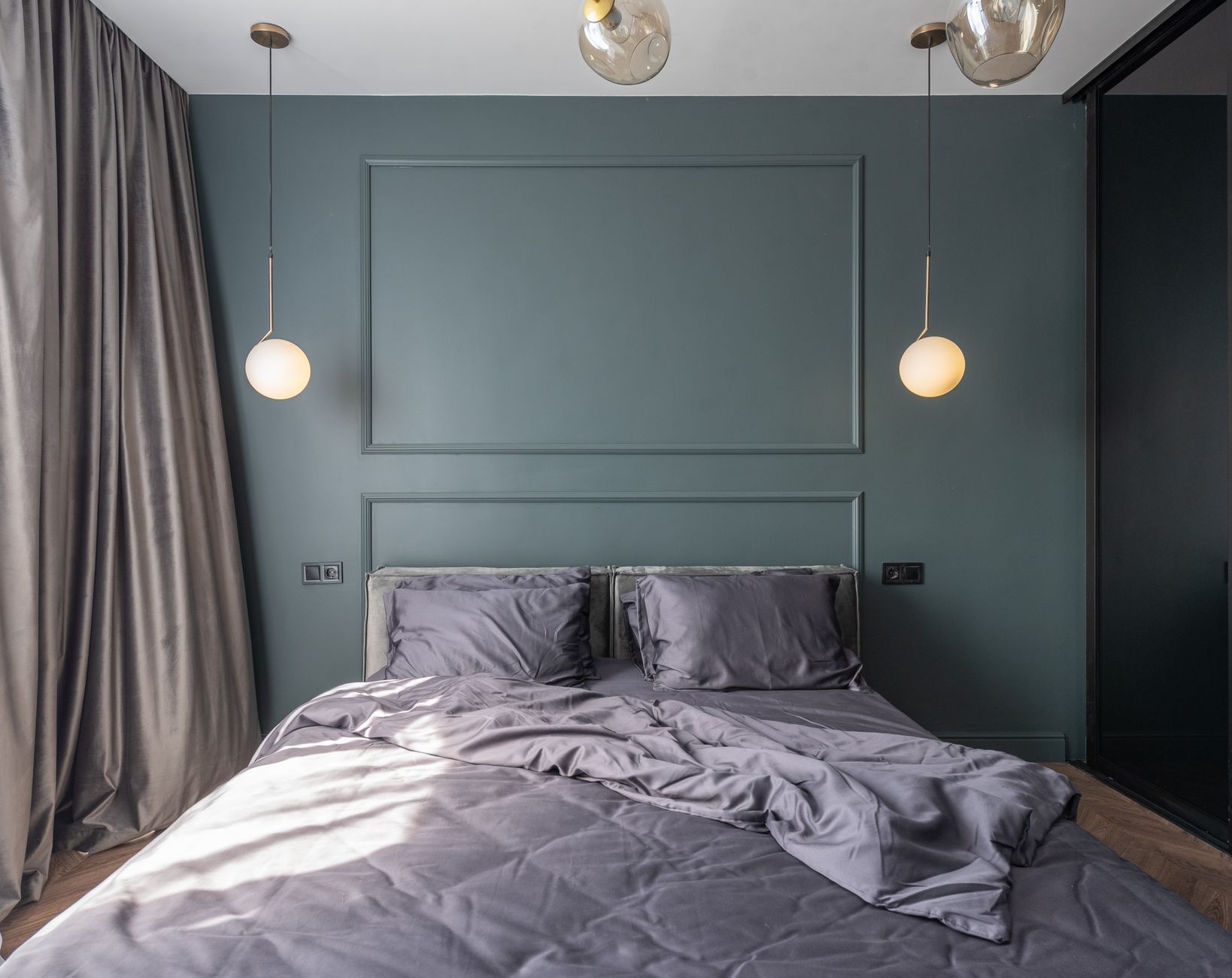 Modern bedroom interior with unmade bed and luminous lighting
