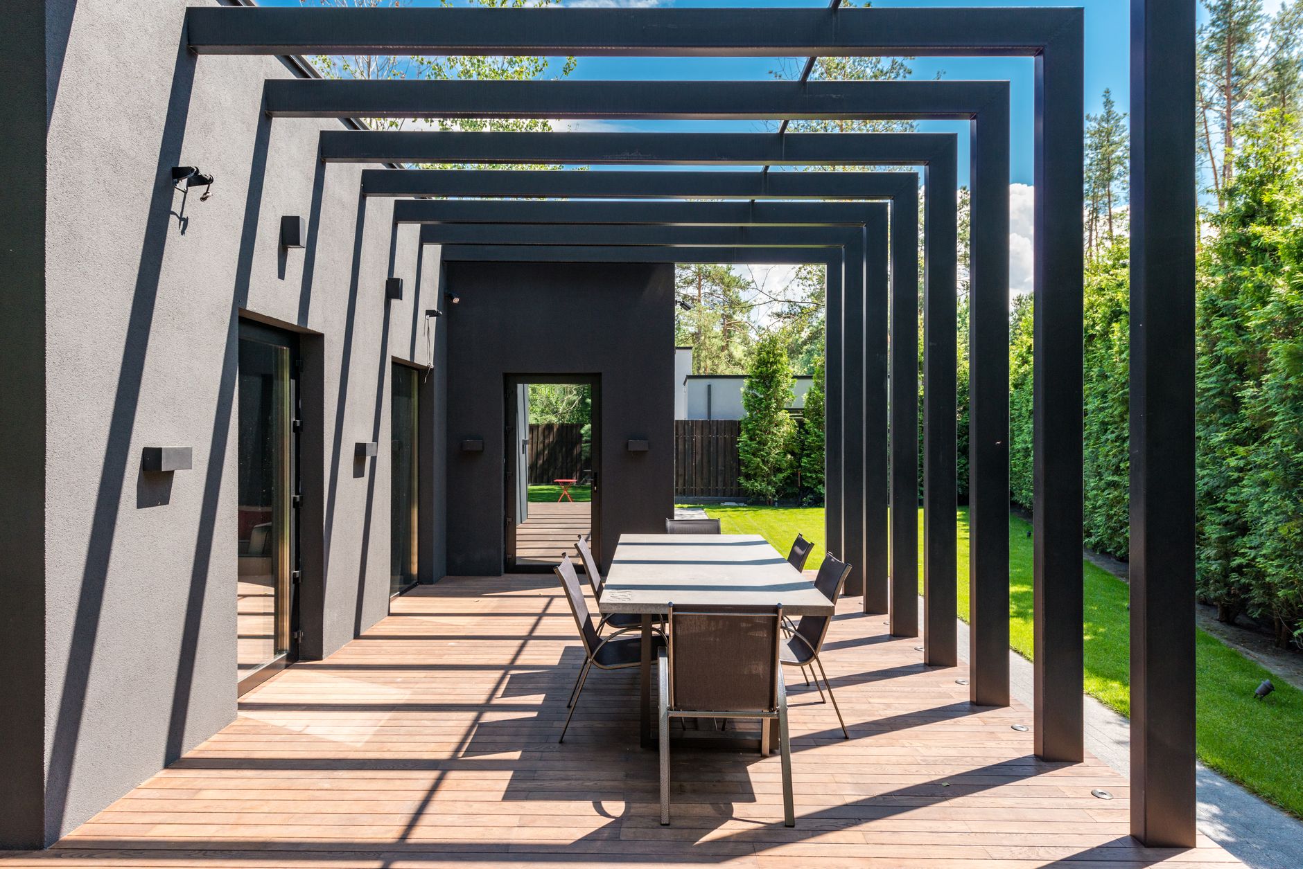 Stylish outdoor patio with plants and comfortable seating