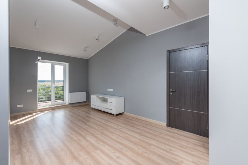 Bright and empty modern room with hardwood floors