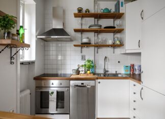 9 Small Kitchen Ideas That Make Cooking Spaces Feel Bigger Contemporary small kitchen featuring stainless steel appliances and open shelving.