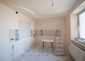 9 Kitchen Renovation Ideas That Add Real Value and Style Spacious kitchen under renovation with ladder and tools, showcasing a fresh new design.