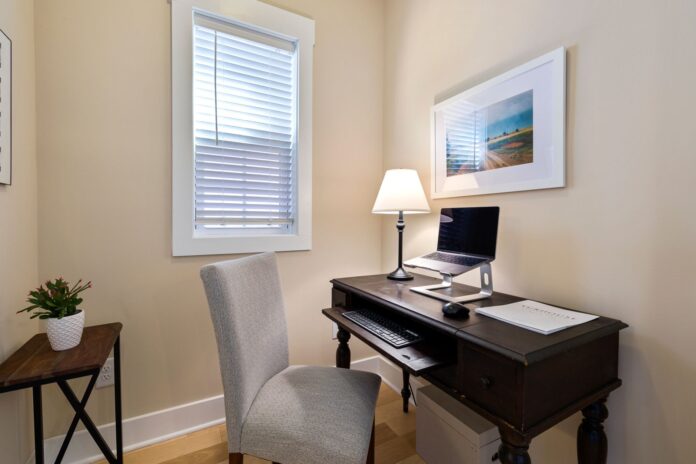 pexels-7168054 A tidy home office space with a wooden desk, laptop, and ambient lighting. Perfect for remote work.