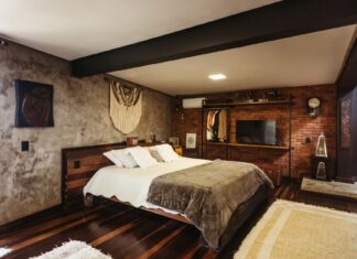 8 Bedroom Lighting Ideas That Set the Mood for Better Sleep Stylish bedroom interior in Santa Teresa, Brazil featuring modern decor and warm tones.