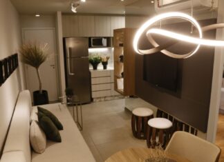 9 Small Space Lighting Ideas That Make Rooms Feel Bigger Luxurious modern living room setup featuring elegant lighting and decor.