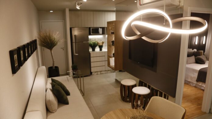 Luxurious modern living room setup featuring elegant lighting and decor.