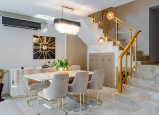 9 Dining Room Decorating Ideas That Make Every Meal Feel Special Modern dining room with marble table, gold accents, and stylish lighting.