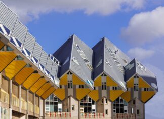 7 Timeless Architectural Elements Every Well-Designed Home Shares Capture of the iconic Cube Houses in Rotterdam with blue sky backdrop, showcasing unique modern architecture.