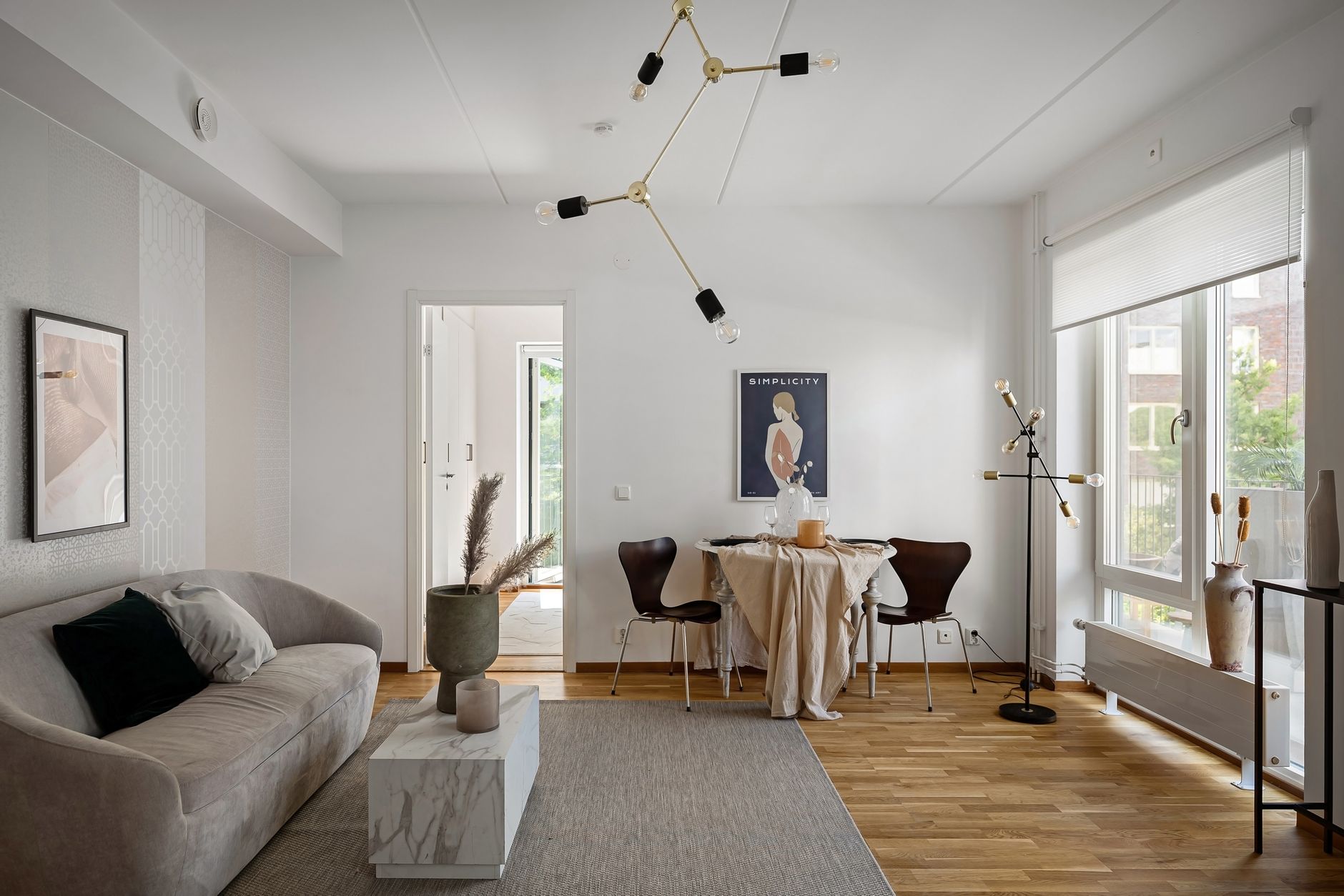 Stylish and modern living room with minimalist decor and natural light.