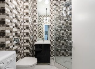 9 Bathroom Shower Ideas That Instantly Feel Like a Spa Interior of bright washroom with washing machine near toilet next to shower and sink with tap