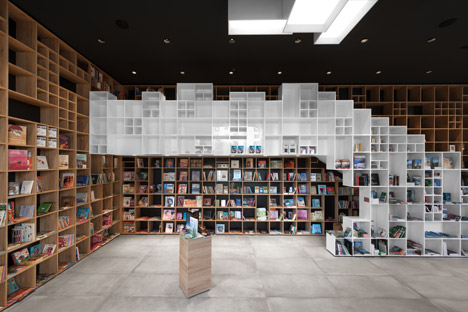 Box-like Shelving Covers Walls In SoNo Arhitekti’s Book Centre Trieste Shop
