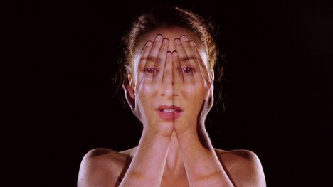 Emmy Curl's Own Image Is Projected Onto Her Face In Come Closer Music Video