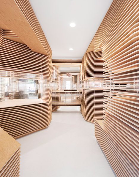 Floating Timber Slabs Create Layered Walls Within New York Shoe Store By Jordana Maisie