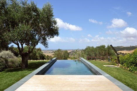 Slate-clad Fontanile Pool Frames Views Of The Italian Countryside From The Garden Of An Old Villa