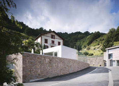 Mining Museum By V2S Contrasts A Traditional Stone Wall With A Metal Box