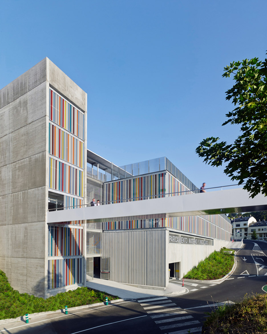 Coloured Metal Slats And Textured Concrete Panels Enclose Hospital Car Park In Spain