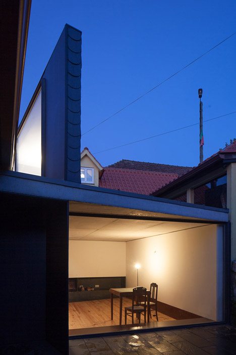 Nuno Melo Sousa Uses A Wedge-shaped Lightwell To Bring Light Into A Courtyard Living Room